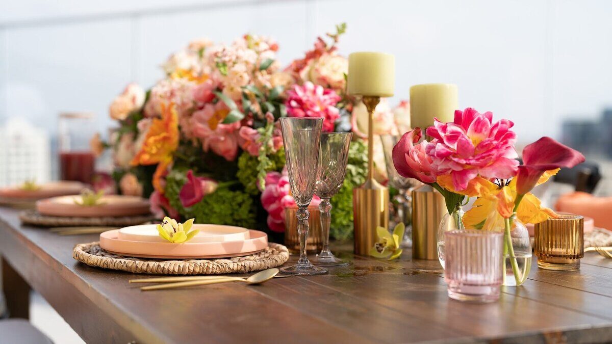 Table with colorful florals and candles